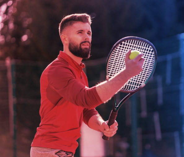 Man serving during tennis game